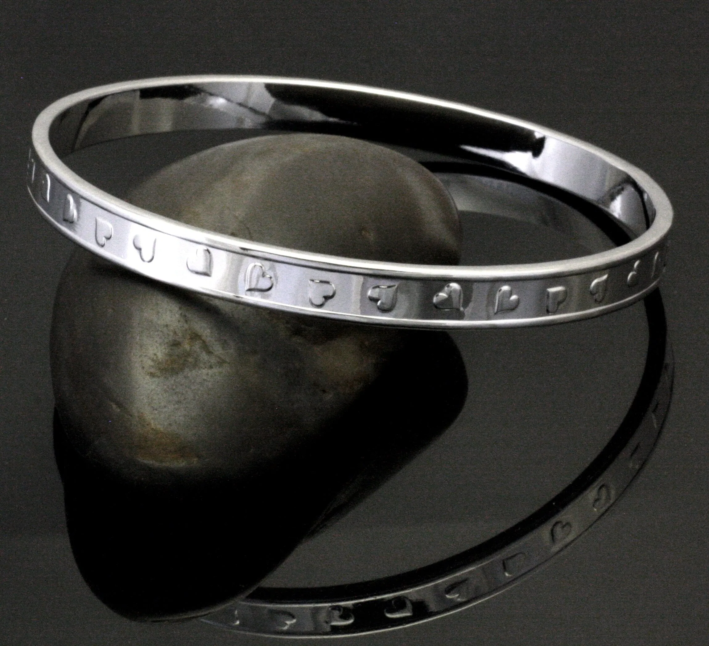 Tumbling Hearts Silver Bangle