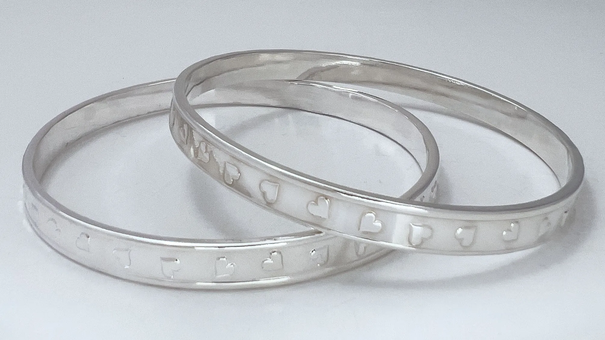 Tumbling Hearts Silver Bangle